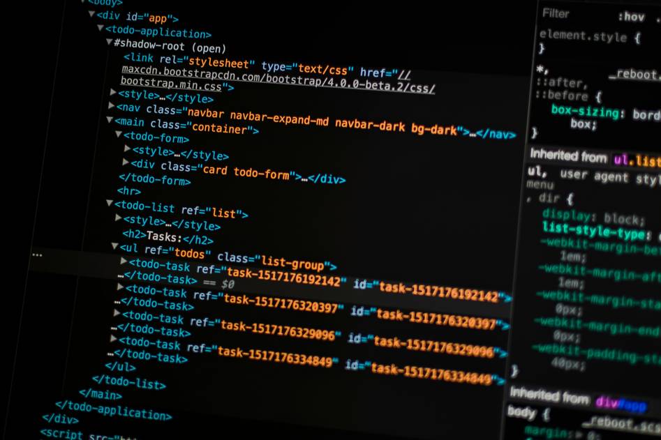 Two developers reviewing smart contract code on dual monitors in a modern tech workspace